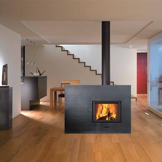 large indoor fireplace feature with stovepipe